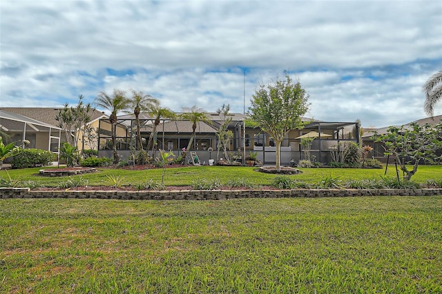 view of yard with a lanai