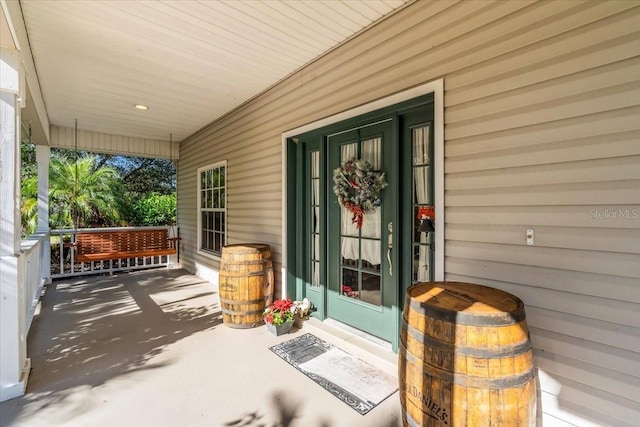 doorway to property with a porch