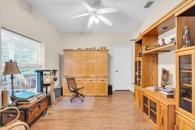 home office featuring ceiling fan and light hardwood / wood-style flooring