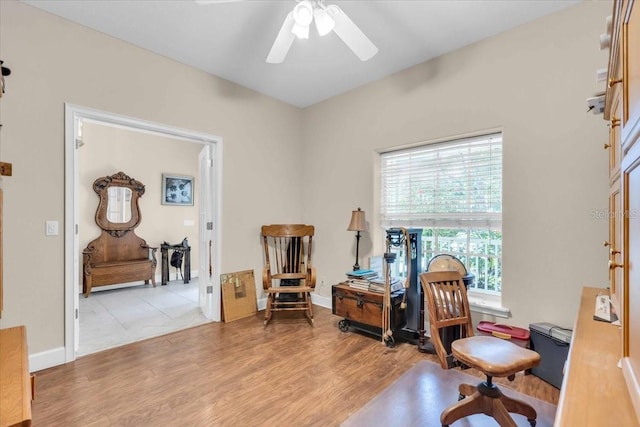 sitting room with light hardwood / wood-style floors and ceiling fan