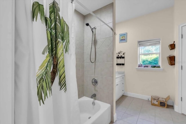 bathroom featuring vanity, tile patterned floors, and shower / bath combo with shower curtain