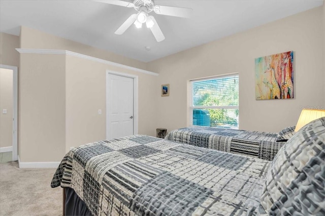 bedroom with light carpet and ceiling fan