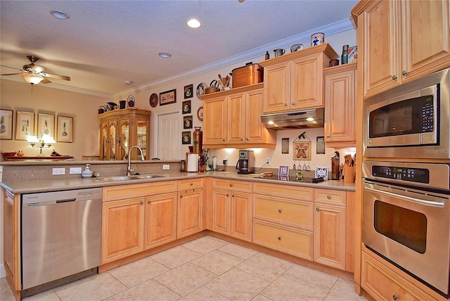 kitchen featuring sink, light brown cabinets, crown molding, light tile patterned floors, and appliances with stainless steel finishes