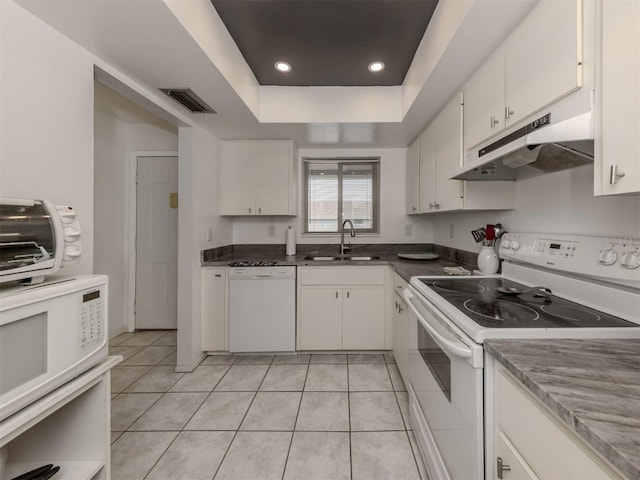 kitchen featuring white cabinetry, white appliances, sink, and light tile patterned floors