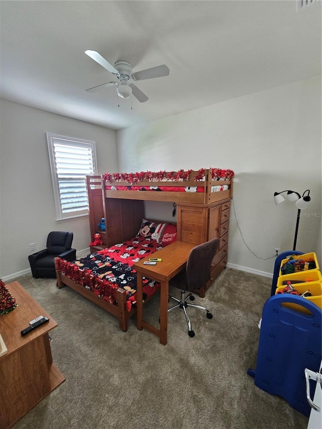 bedroom with ceiling fan and dark colored carpet