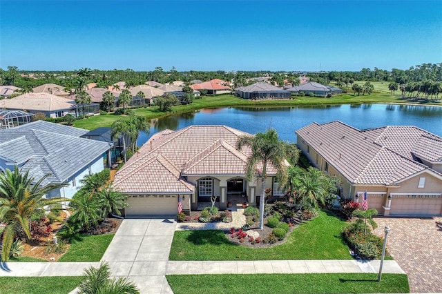 birds eye view of property with a water view