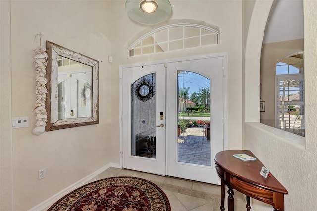 tiled foyer entrance with french doors