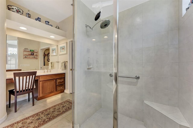 bathroom featuring tile patterned floors, vanity, plenty of natural light, and a shower with shower door