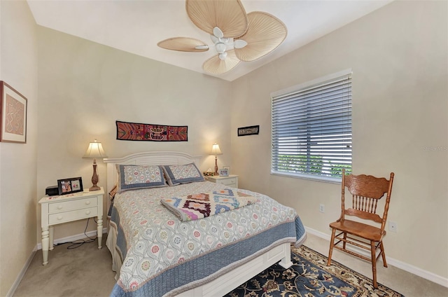 bedroom featuring ceiling fan and light carpet