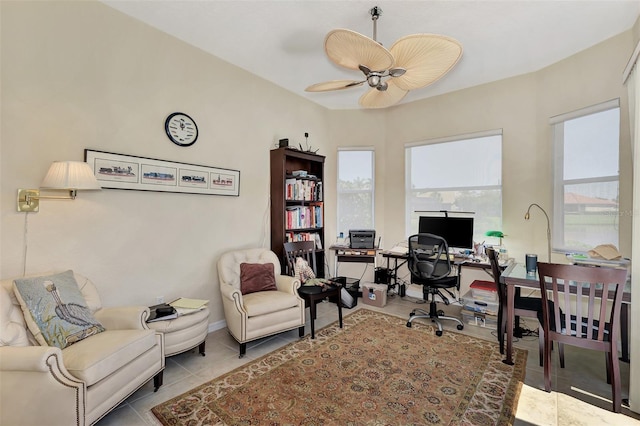 tiled office space with ceiling fan