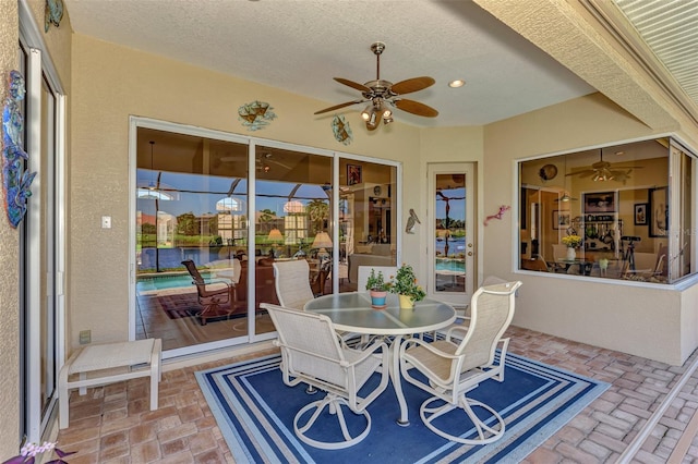 sunroom / solarium with ceiling fan