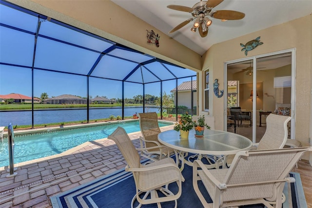 view of pool featuring ceiling fan and a water view