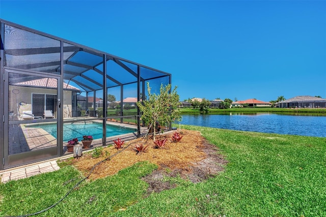 view of swimming pool with a lanai, a water view, and a lawn