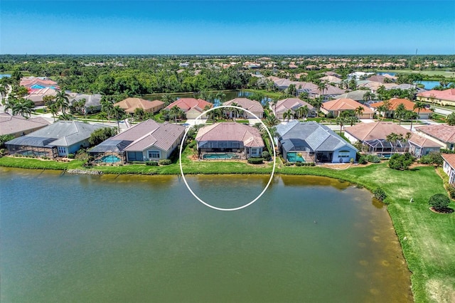 bird's eye view with a water view