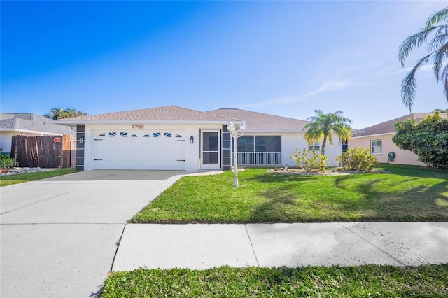 ranch-style home with a front yard and a garage