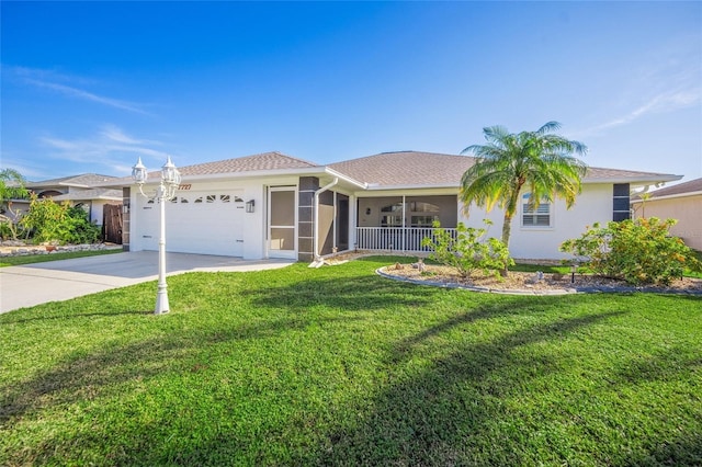 ranch-style home with a garage and a front lawn