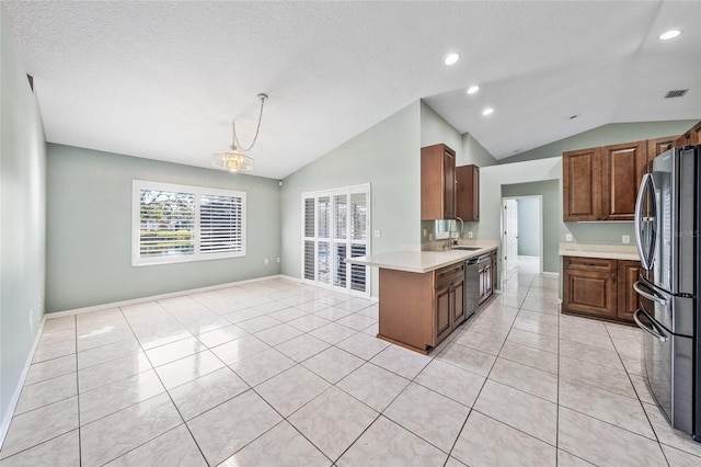 kitchen with a textured ceiling, a chandelier, stainless steel appliances, and lofted ceiling