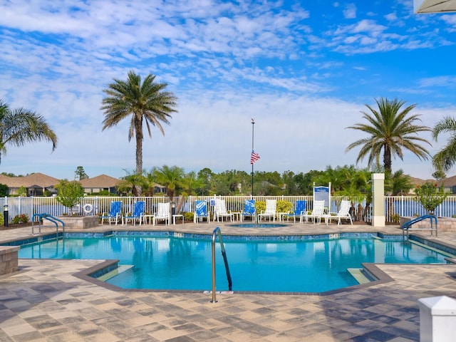 view of swimming pool with a patio area