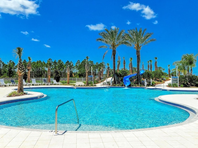 view of pool featuring a water slide