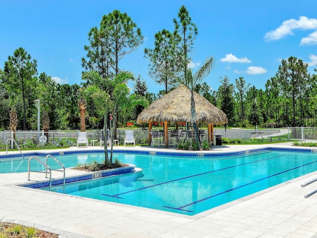 view of swimming pool featuring a patio area and a gazebo