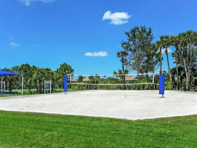 view of property's community featuring volleyball court and a yard