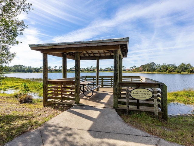 dock area with a gazebo and a water view