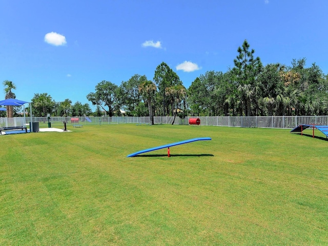 view of community featuring a yard