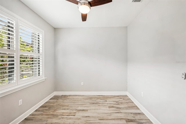 empty room with light wood-type flooring and ceiling fan