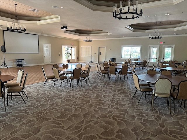 2572 Daisy Dr, North Port, FL 34289 - dining space featuring a raised ceiling, stone floors, a chandelier, and ornamental molding