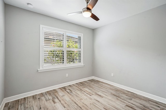 spare room with light hardwood / wood-style flooring and ceiling fan