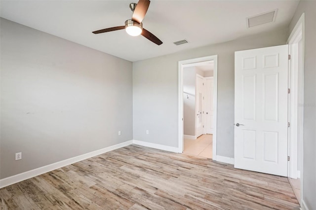 unfurnished bedroom with ceiling fan and light hardwood / wood-style floors