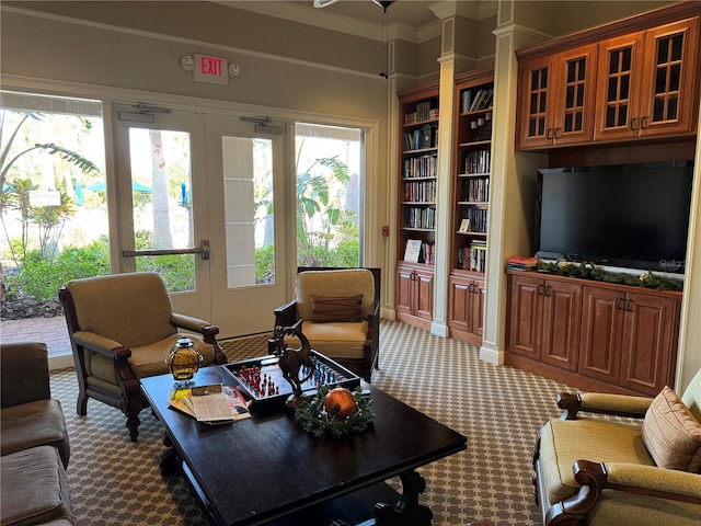 living room featuring carpet floors and ornamental molding