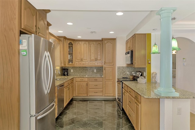 kitchen featuring hanging light fixtures, light stone countertops, tasteful backsplash, kitchen peninsula, and stainless steel appliances