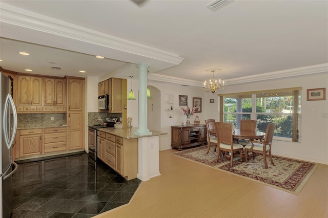 kitchen featuring kitchen peninsula, ornamental molding, pendant lighting, and appliances with stainless steel finishes