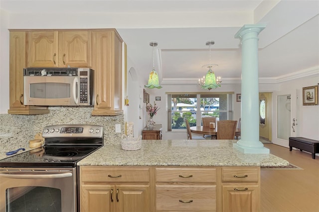 kitchen with light stone countertops, stainless steel appliances, light brown cabinetry, and decorative columns