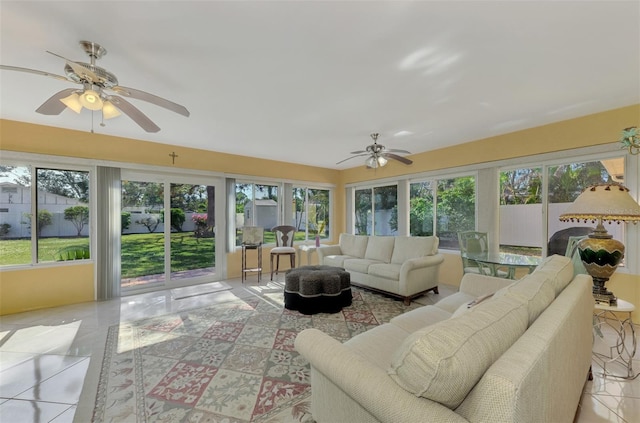 sunroom featuring ceiling fan and plenty of natural light