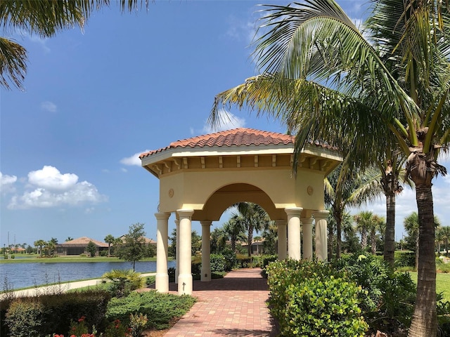 surrounding community featuring a water view