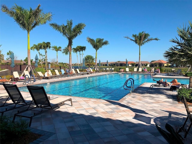 view of swimming pool with a patio area