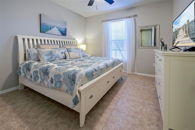 bedroom with ceiling fan and light tile patterned flooring