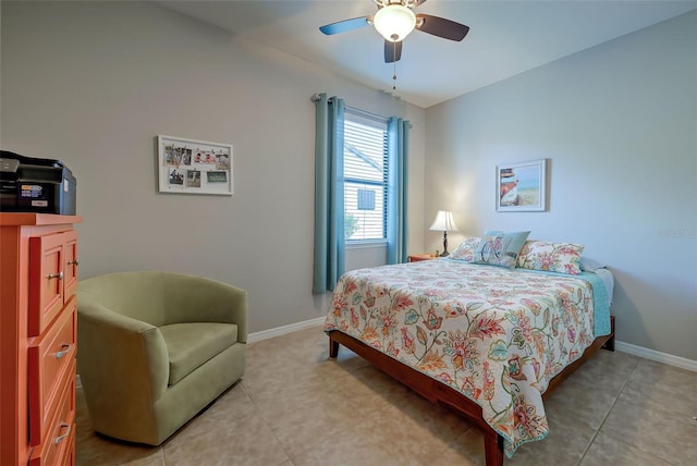 tiled bedroom featuring ceiling fan