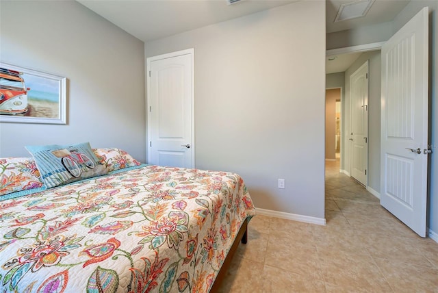 bedroom with light tile patterned floors