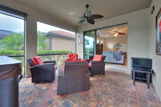 view of patio with ceiling fan and an outdoor hangout area