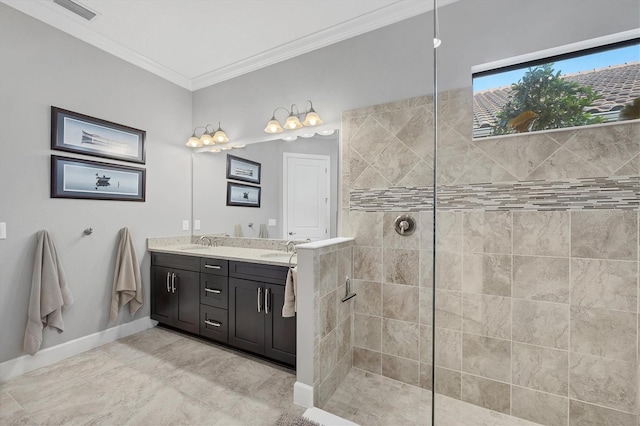 bathroom featuring vanity, a tile shower, and ornamental molding