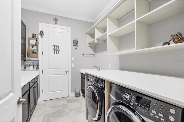 laundry area with independent washer and dryer, ornamental molding, and sink