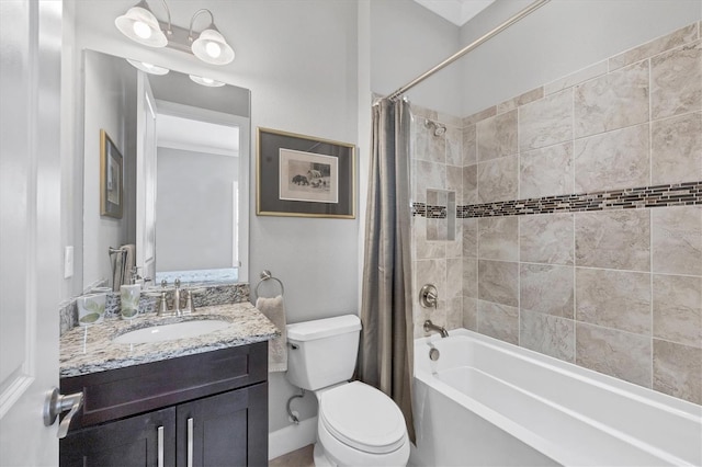 full bathroom featuring shower / tub combo with curtain, vanity, and toilet