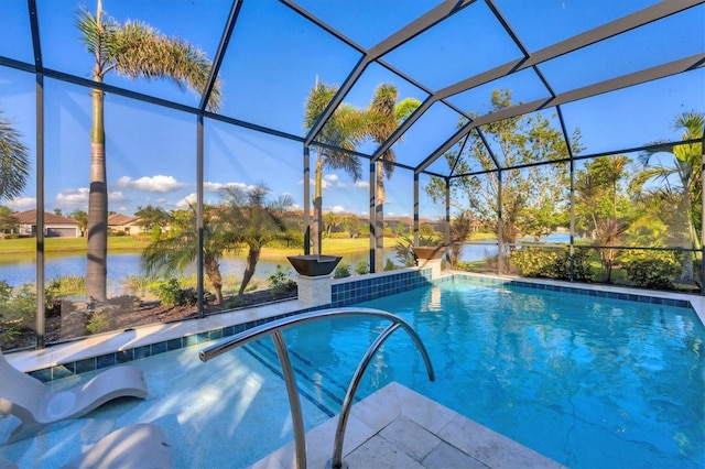 outdoor pool featuring a lanai, a water view, and a patio area