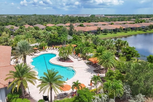 community pool featuring a patio and a water view