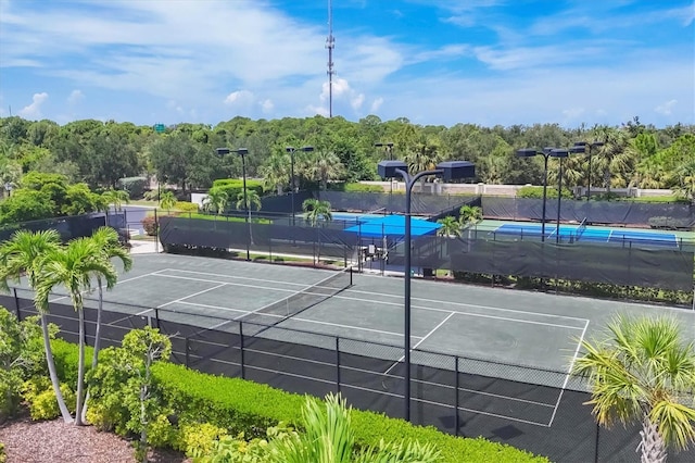 view of sport court with fence