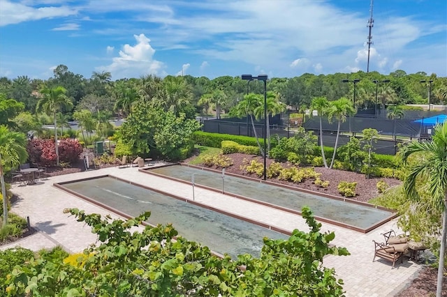view of community featuring fence