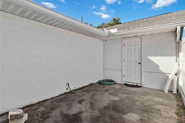 entrance to property featuring a patio